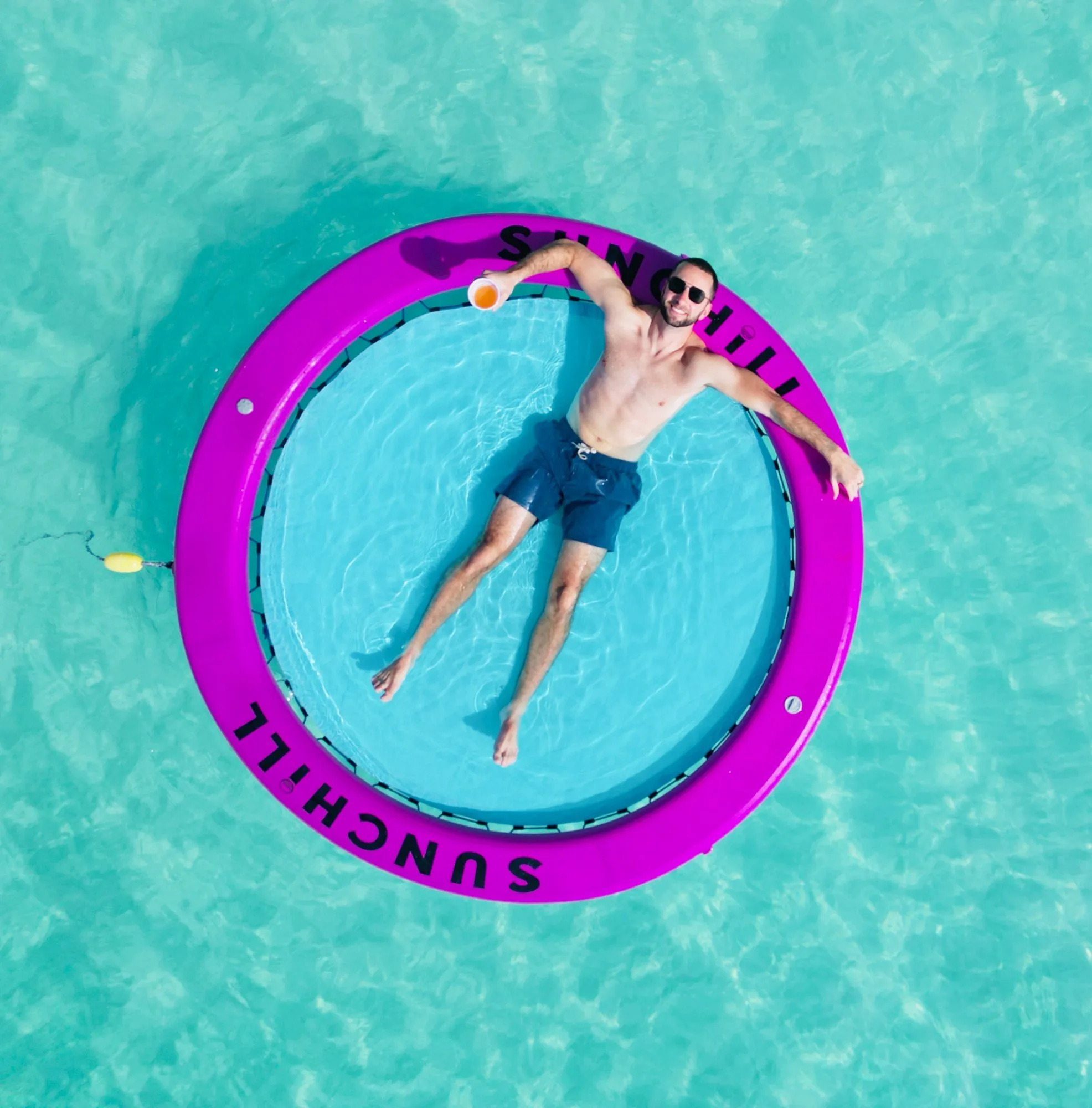 Relaxing in a water hammock off Seven Mile Beach
