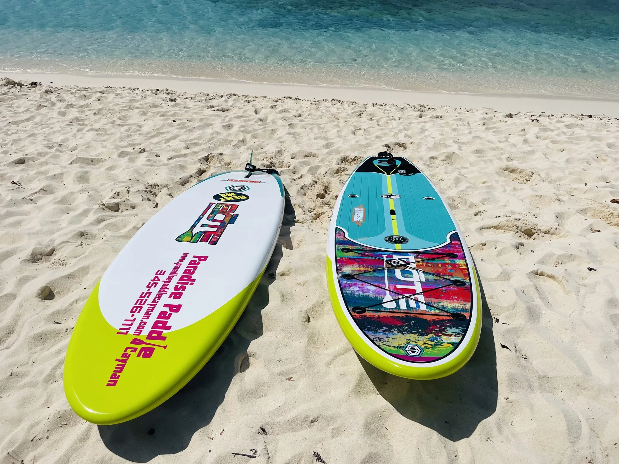 Paddleboarders on clear Caribbean water